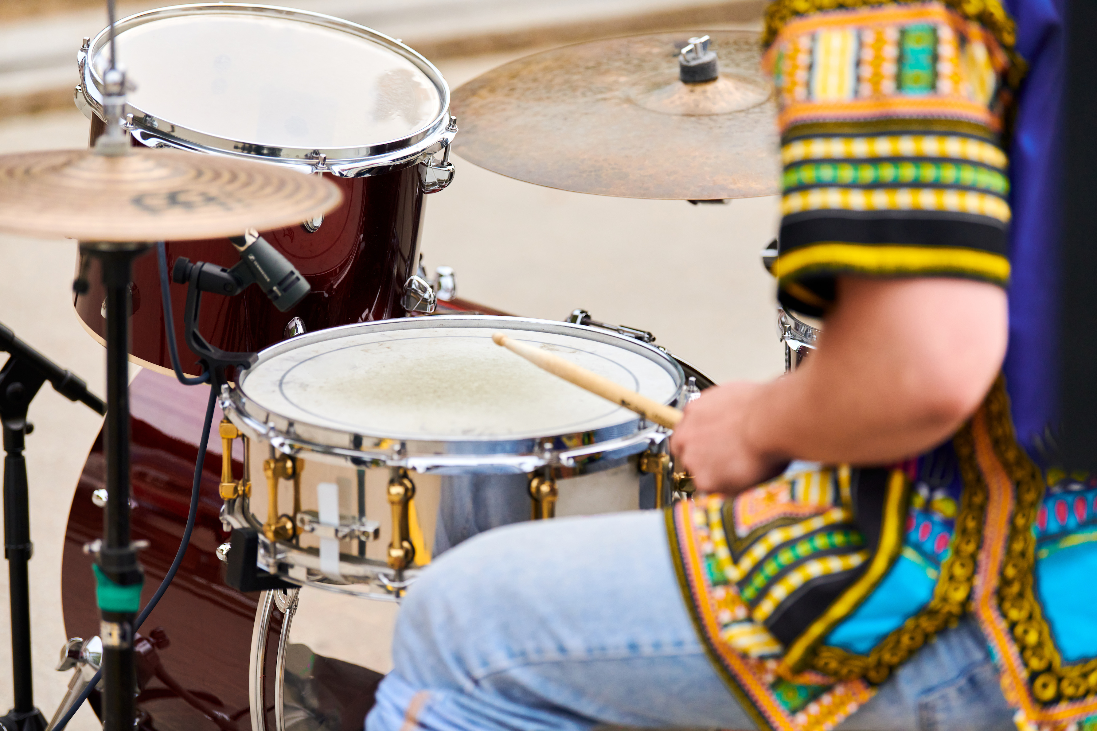 A drummer performing live on stage