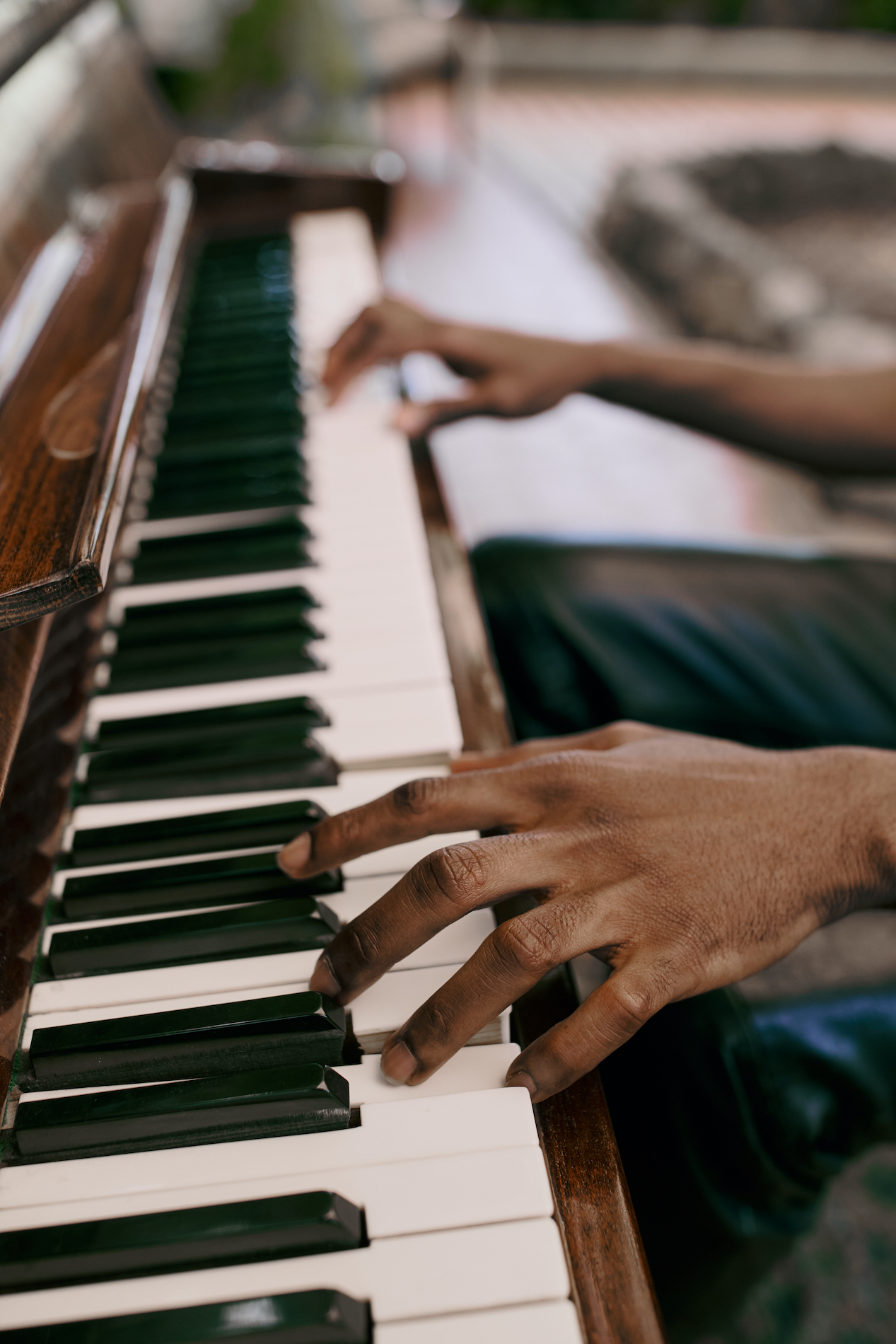 Hands playing piano during a student recital